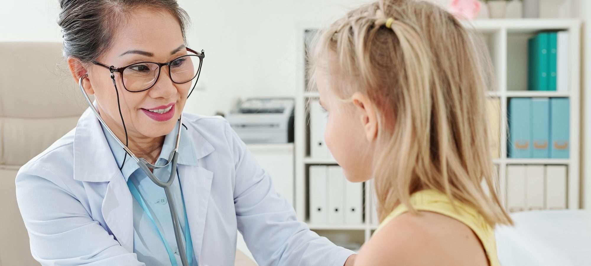 pediatrician-checking-heartbeat-of-patient.jpg